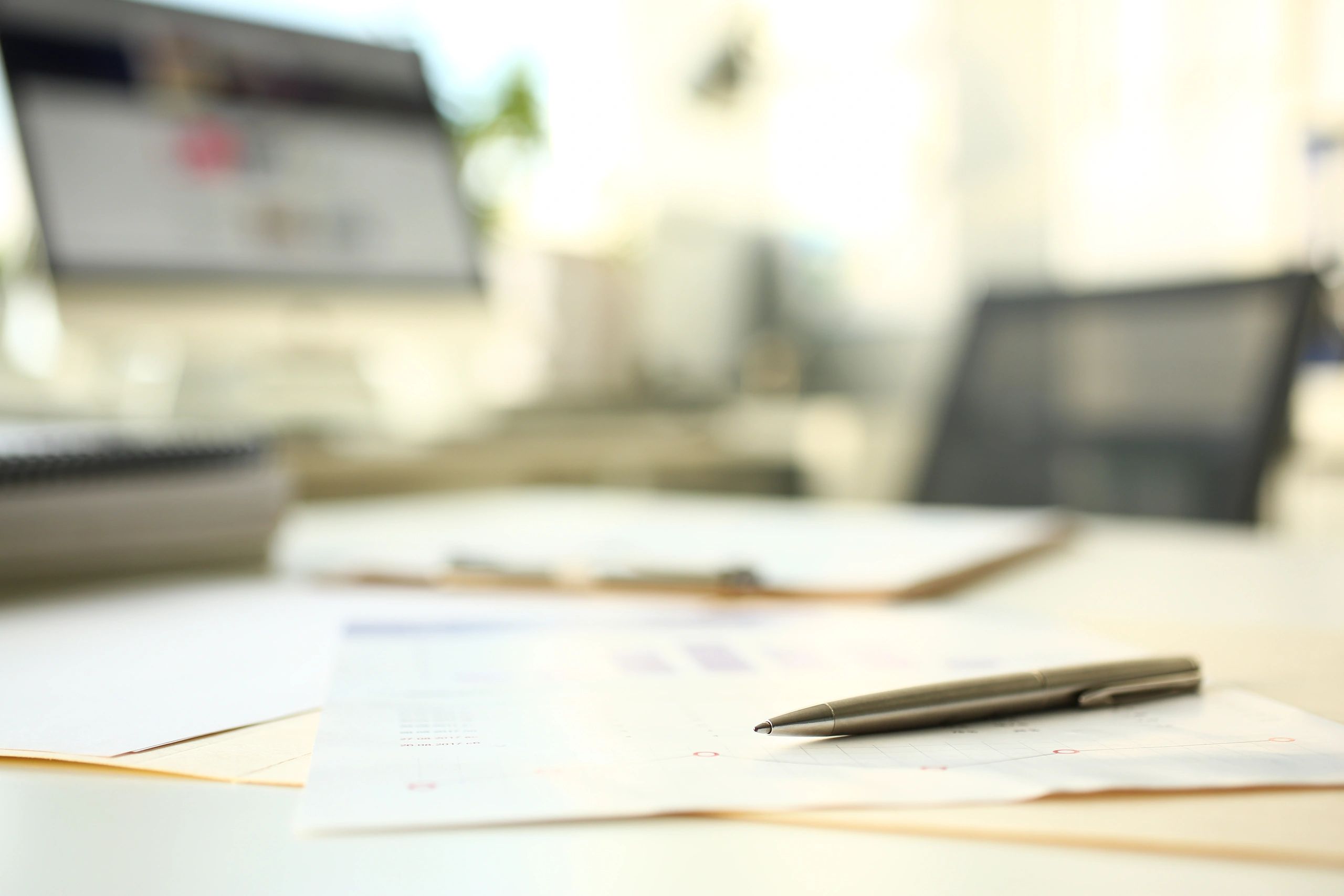 Payroll and finance documents on a desk