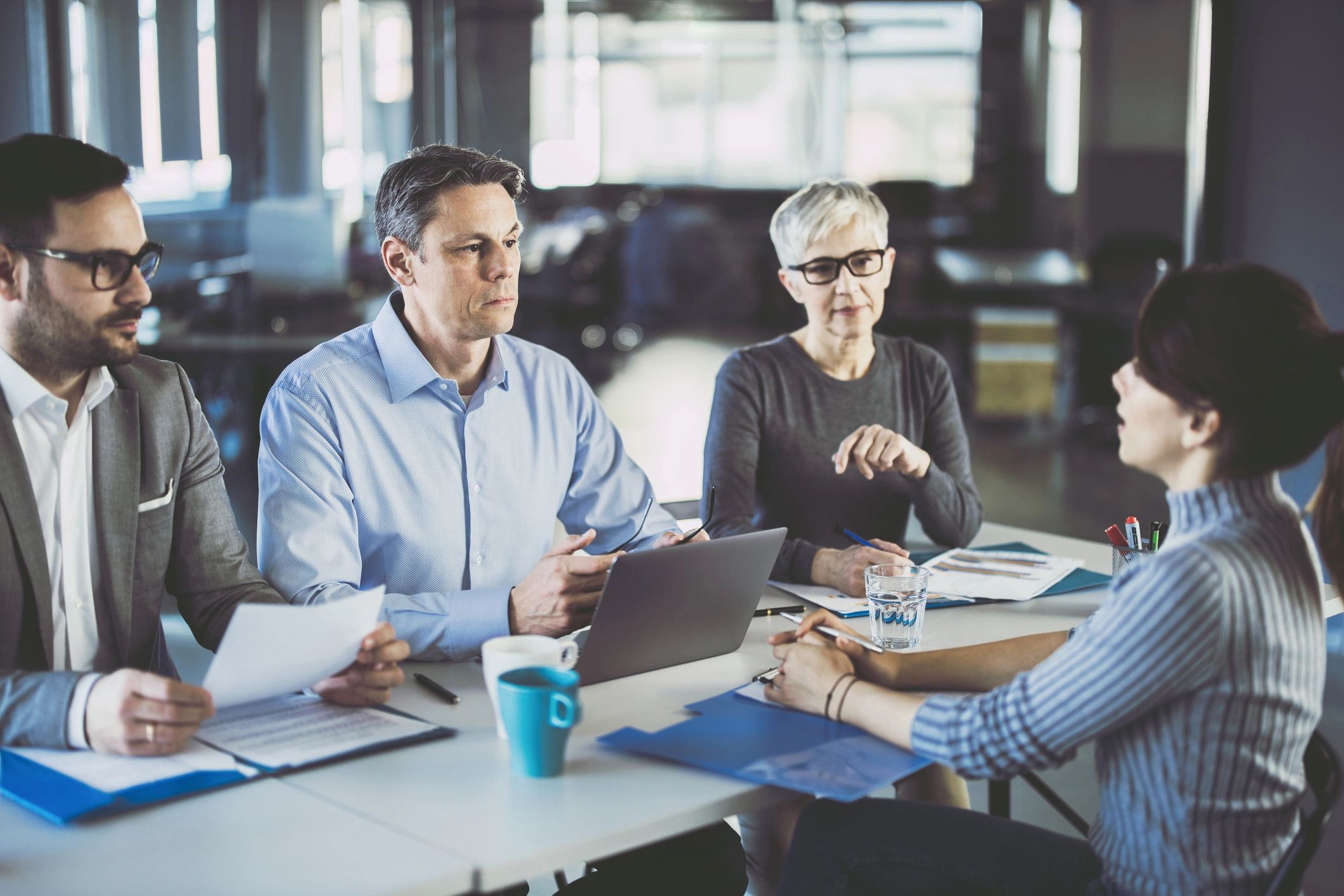 Recruitment team interviewing a candidate in an office